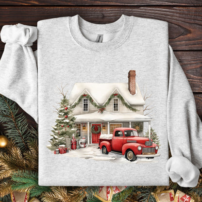 Ash Gildan sweatshirt with a watercolor farmhouse, red vintage truck, and Christmas tree in snow.