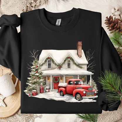 Black Gildan sweatshirt with a watercolor farmhouse, red vintage truck, Christmas tree, and snow.