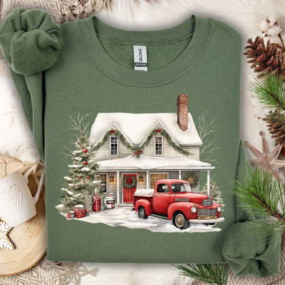 Military Green Gildan sweatshirt with a watercolor farmhouse, red vintage truck, and Christmas tree in snow.
