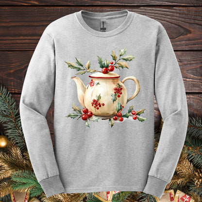 Ash long sleeve tee with a watercolor farmhouse Christmas teapot, holly, and evergreens design.