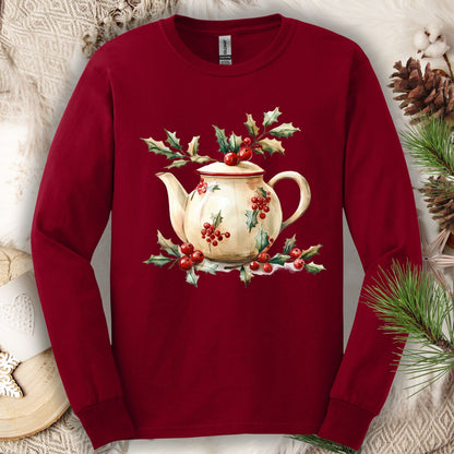 Cardinal Red long sleeve tee with a watercolor farmhouse teapot, holly, and evergreens.