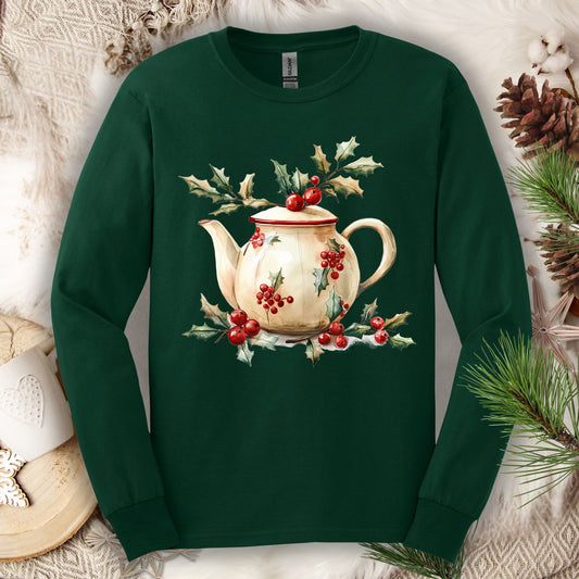 Forest Green long sleeve tee with a watercolor farmhouse Christmas teapot, holly, and evergreens.