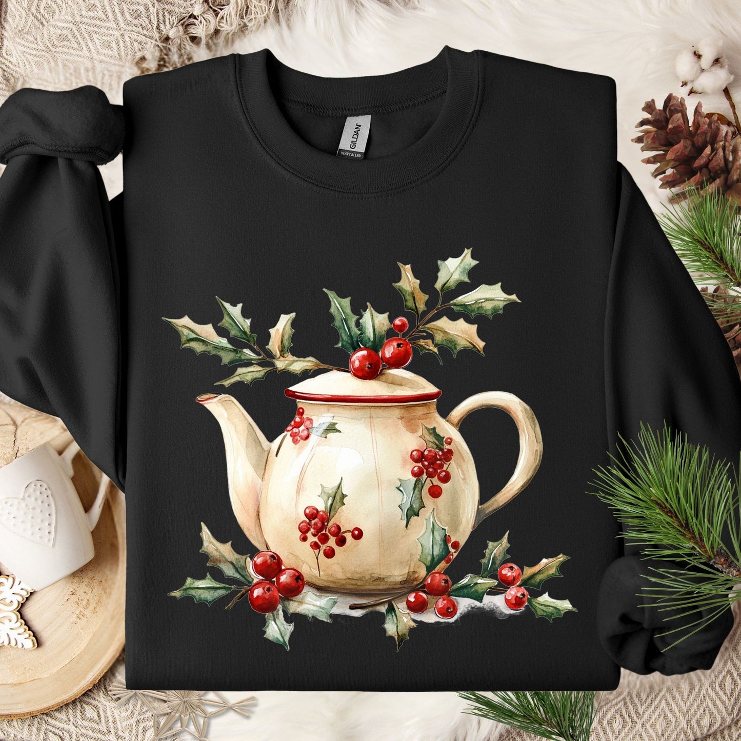 Black Gildan sweatshirt with a watercolor farmhouse teapot, holly, and berries design.