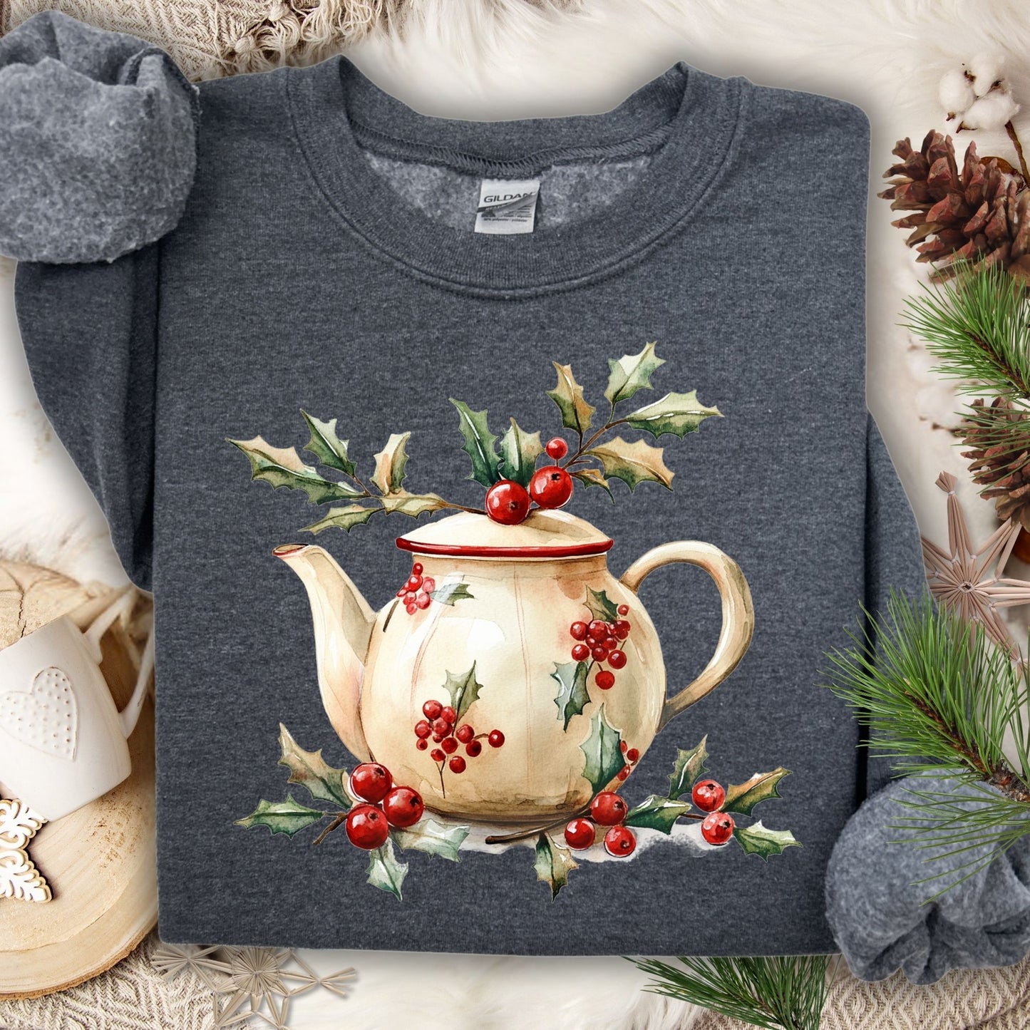 Dark Heather Gildan sweatshirt with a watercolor farmhouse Christmas teapot and holly berries.