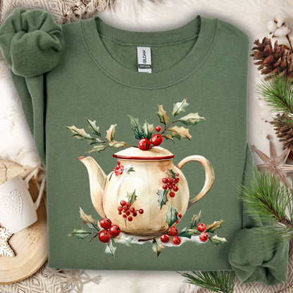 Military Green Gildan fleece sweatshirt with a watercolor farmhouse Christmas teapot and holly design.
