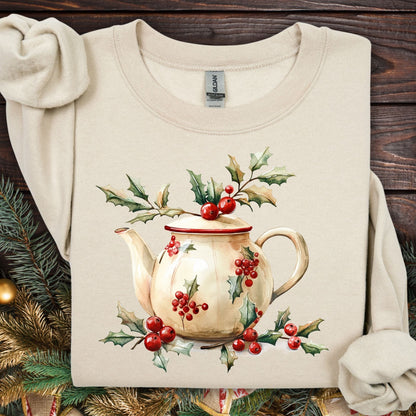 Sand Gildan sweatshirt with a watercolor farmhouse Christmas teapot and holly design.