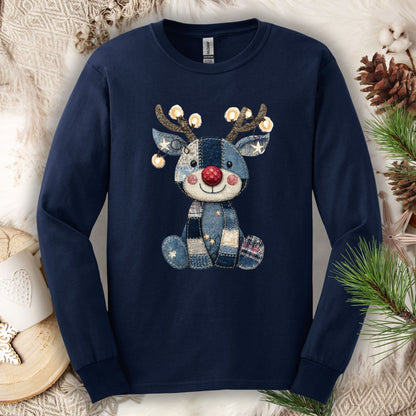 Navy long sleeve tee with a faux denim patchwork Rudolph print, sparkling Christmas lights on antlers.