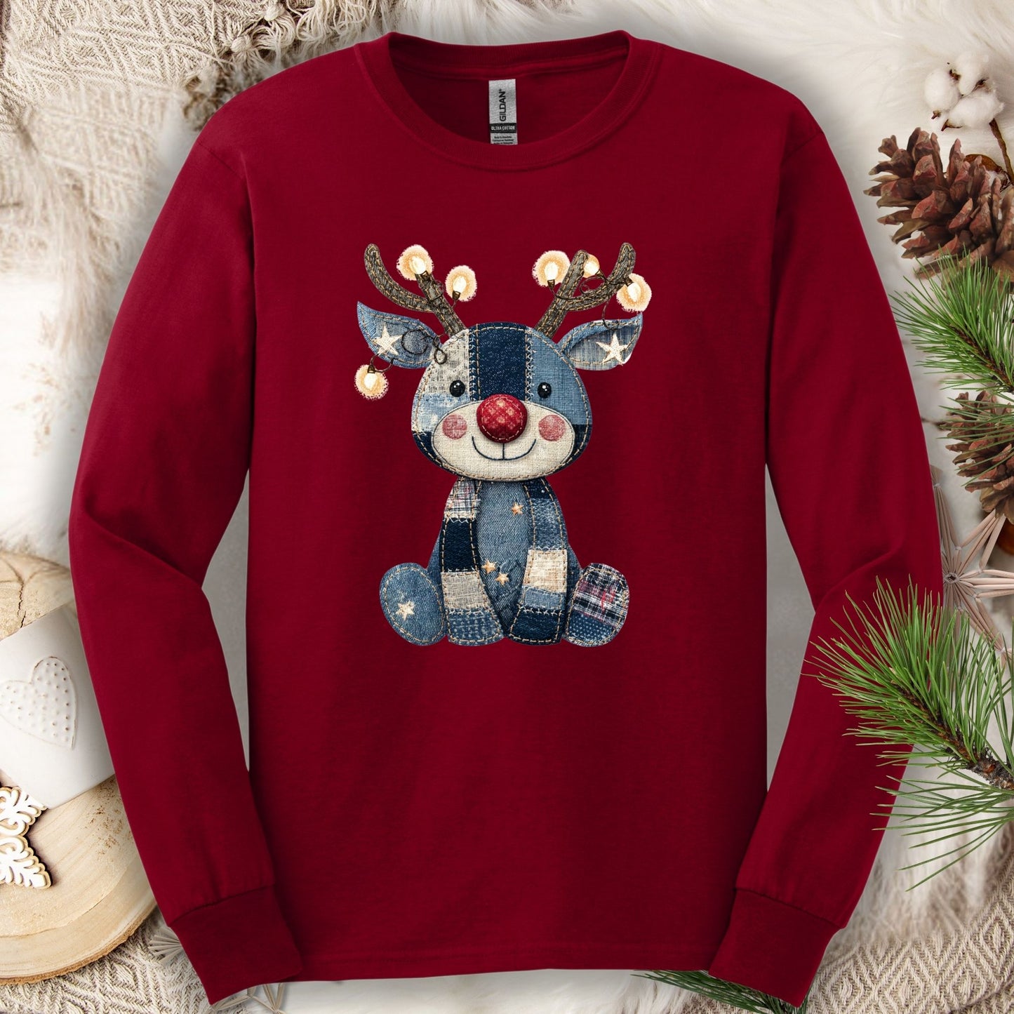 Cardinal Red long sleeve tee with a faux denim patchwork Rudolph print, antlers lit with Christmas lights.