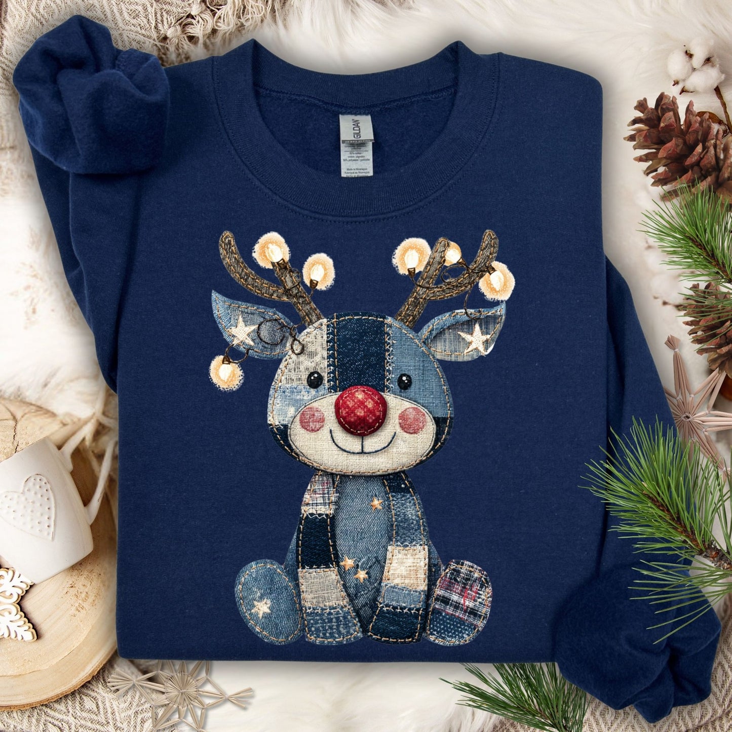 Navy Faux Denim Patchwork Rudolph Sweatshirt with twinkling lights, a red nose, and stitched-look details.