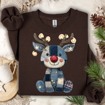 Dark chocolate Gildan sweatshirt with a faux denim patchwork baby Rudolph wearing twinkling lights.