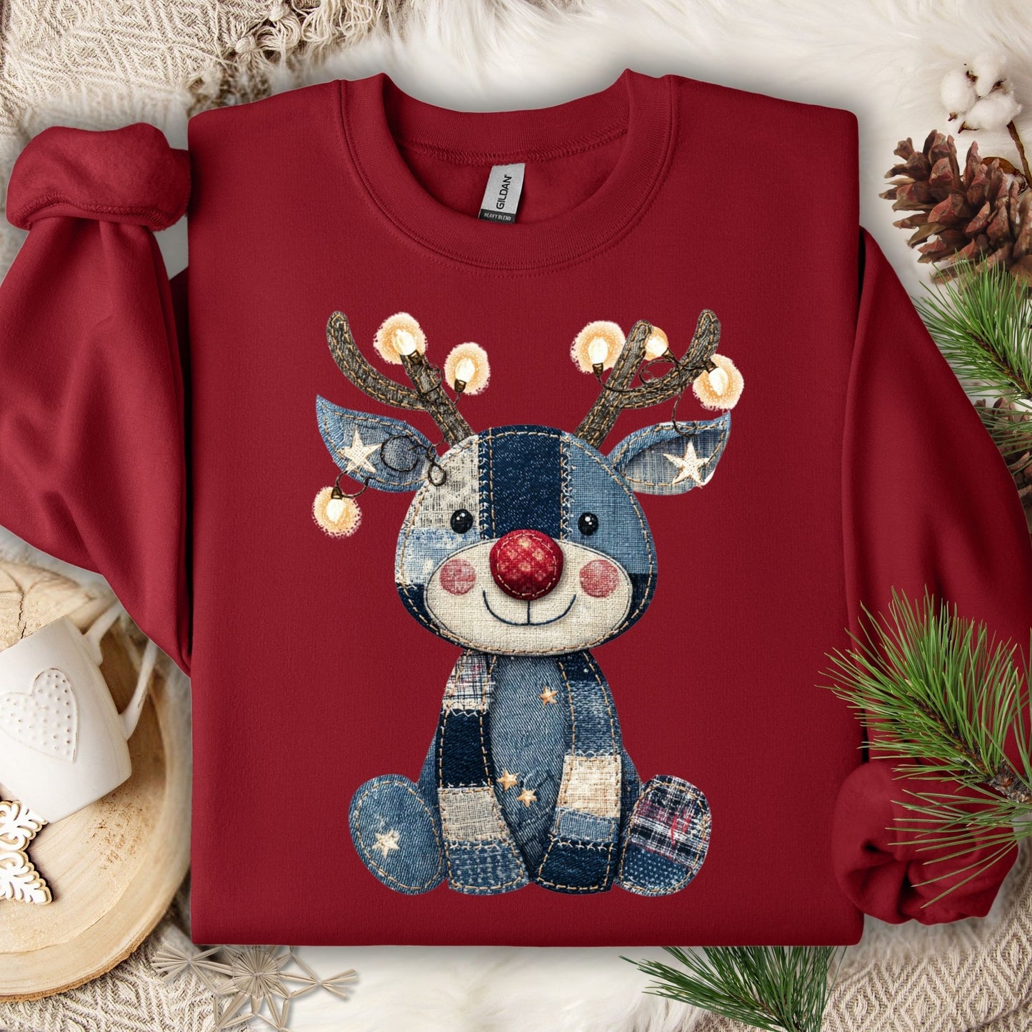 Cardinal Red sweatshirt with a printed faux denim patchwork Rudolph, twinkling lights on antlers.