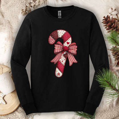 Black long sleeve tee with a vintage faux patchwork candy cane and red bow design.
