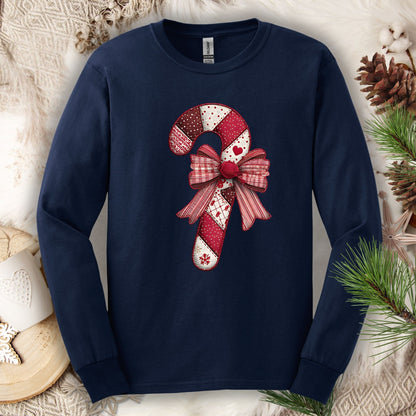 Navy long sleeve tee with a vintage faux patchwork candy cane and red bow design.