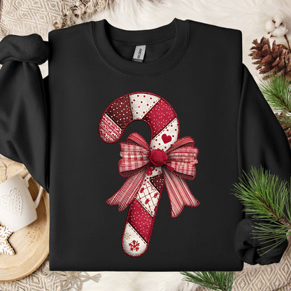 Black Gildan sweatshirt with a faux patchwork candy cane and red bow design.