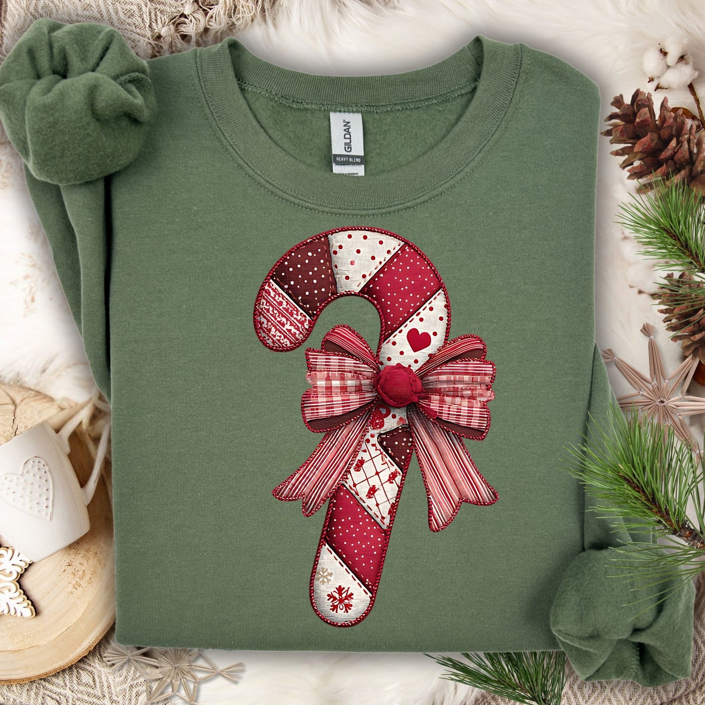 Military Green Gildan sweatshirt with a vintage faux patchwork candy cane and red bow design.