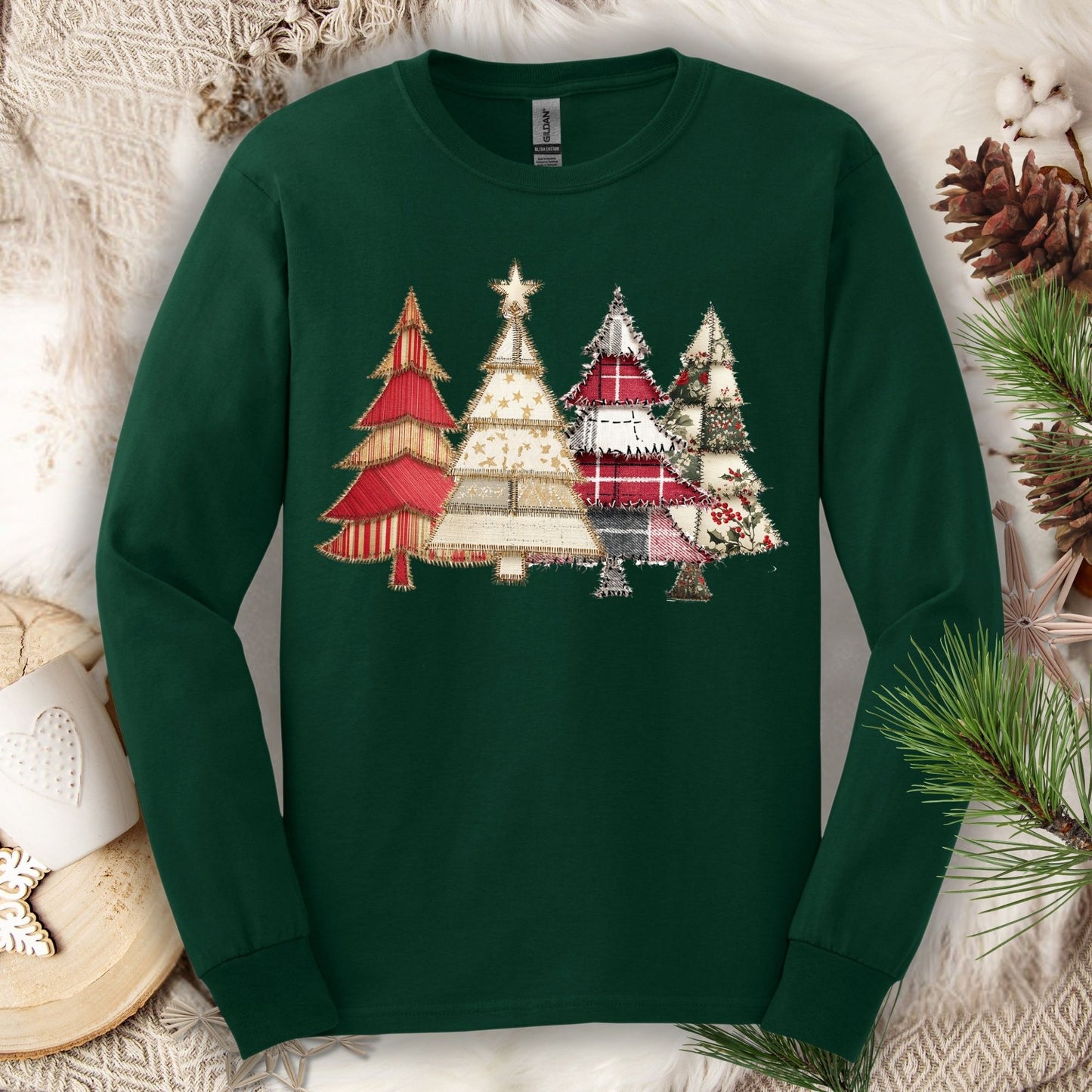 Forest green long sleeve tee with a printed rustic patchwork Christmas tree design.