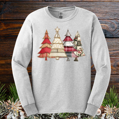 Ash long sleeve tee with a rustic faux patchwork Christmas tree design in reds, greens, and neutrals.