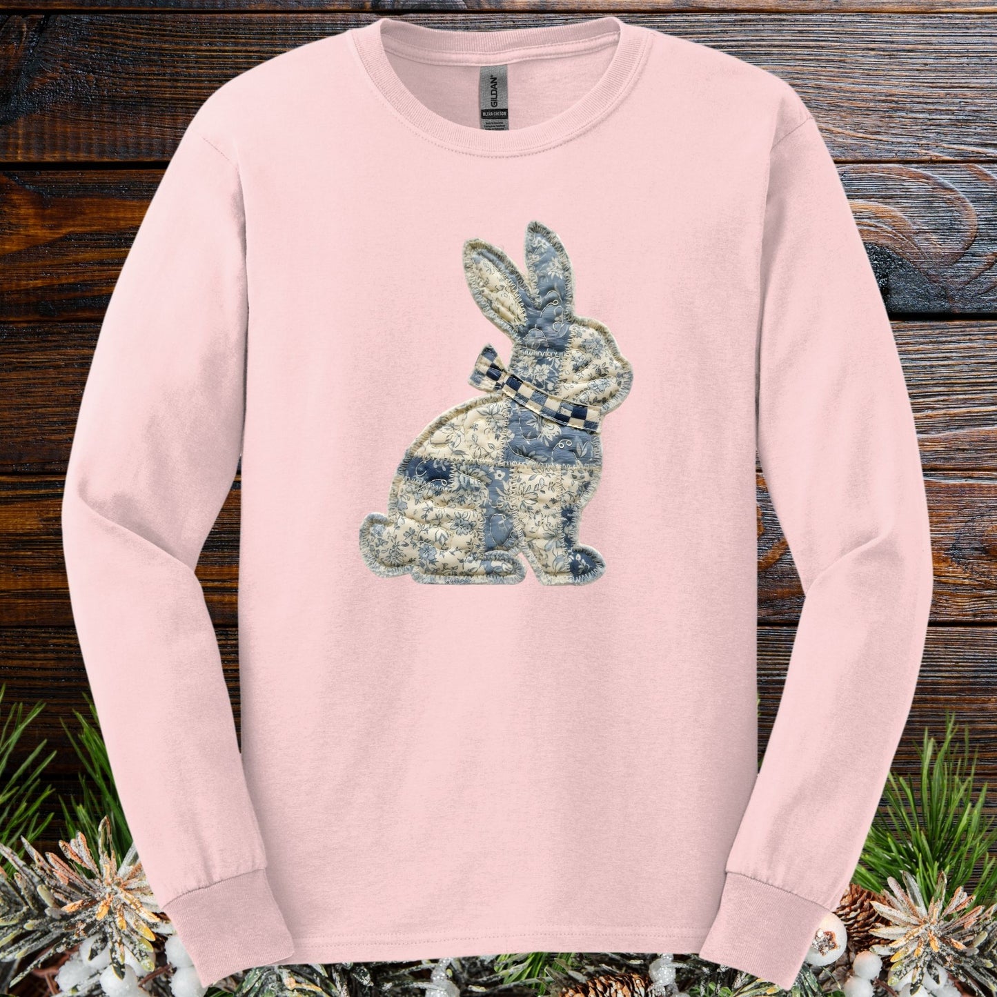 Light pink long-sleeve tee with a faux patchwork blue and white country bunny design.