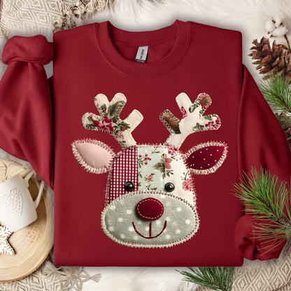 Cardinal Red Gildan sweatshirt with a faux patchwork Rudolph face in sage green, rustic red, and floral patterns.