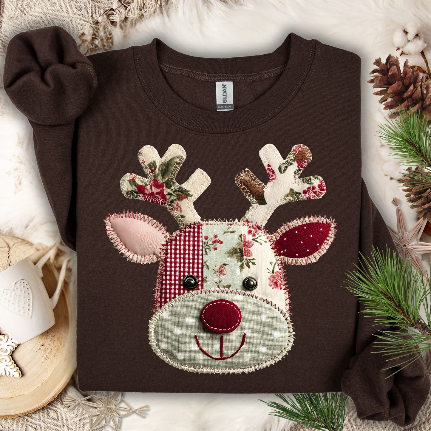 Dark Chocolate Gildan sweatshirt with a faux patchwork Rudolph face in sage green, rustic red, and floral fabrics.
