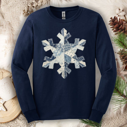 Navy long sleeve tee with a blue and white faux patchwork snowflake design.