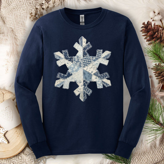 Navy long sleeve tee with a blue and white faux patchwork snowflake design.