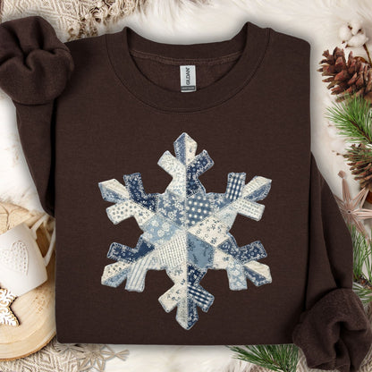 Dark chocolate sweatshirt with a large blue and white faux patchwork snowflake design.