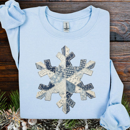 Light blue S sweatshirt with a faux patchwork blue and white snowflake design.