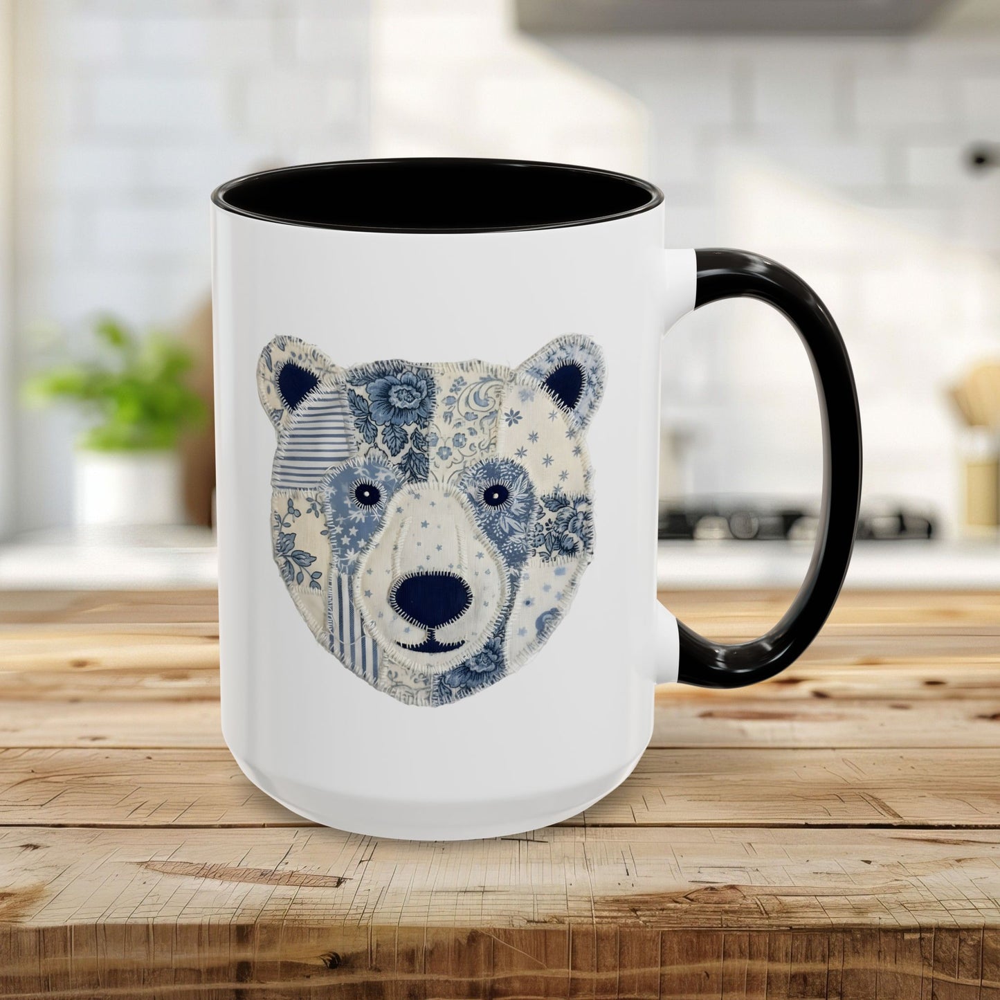 15oz white ceramic mug with black rim, handle, and a blue & white faux patchwork winter bear design.