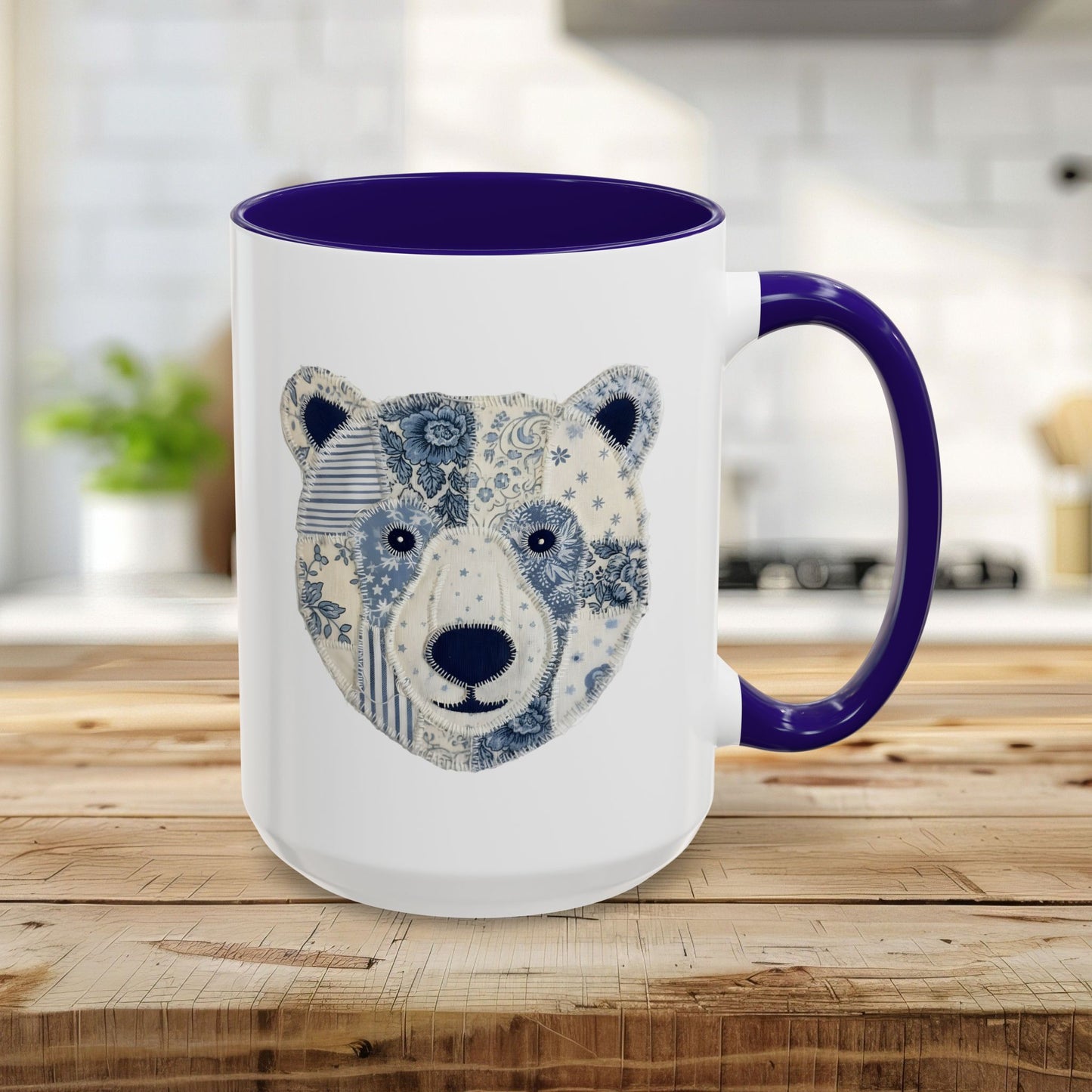 15oz navy blue ceramic mug with a faux patchwork winter bear face design.
