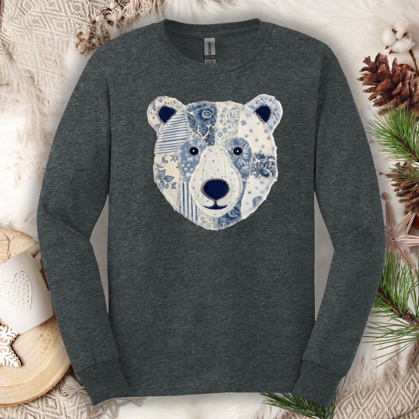Dark Heather long sleeve tee with a faux blue and white patchwork winter bear face design.