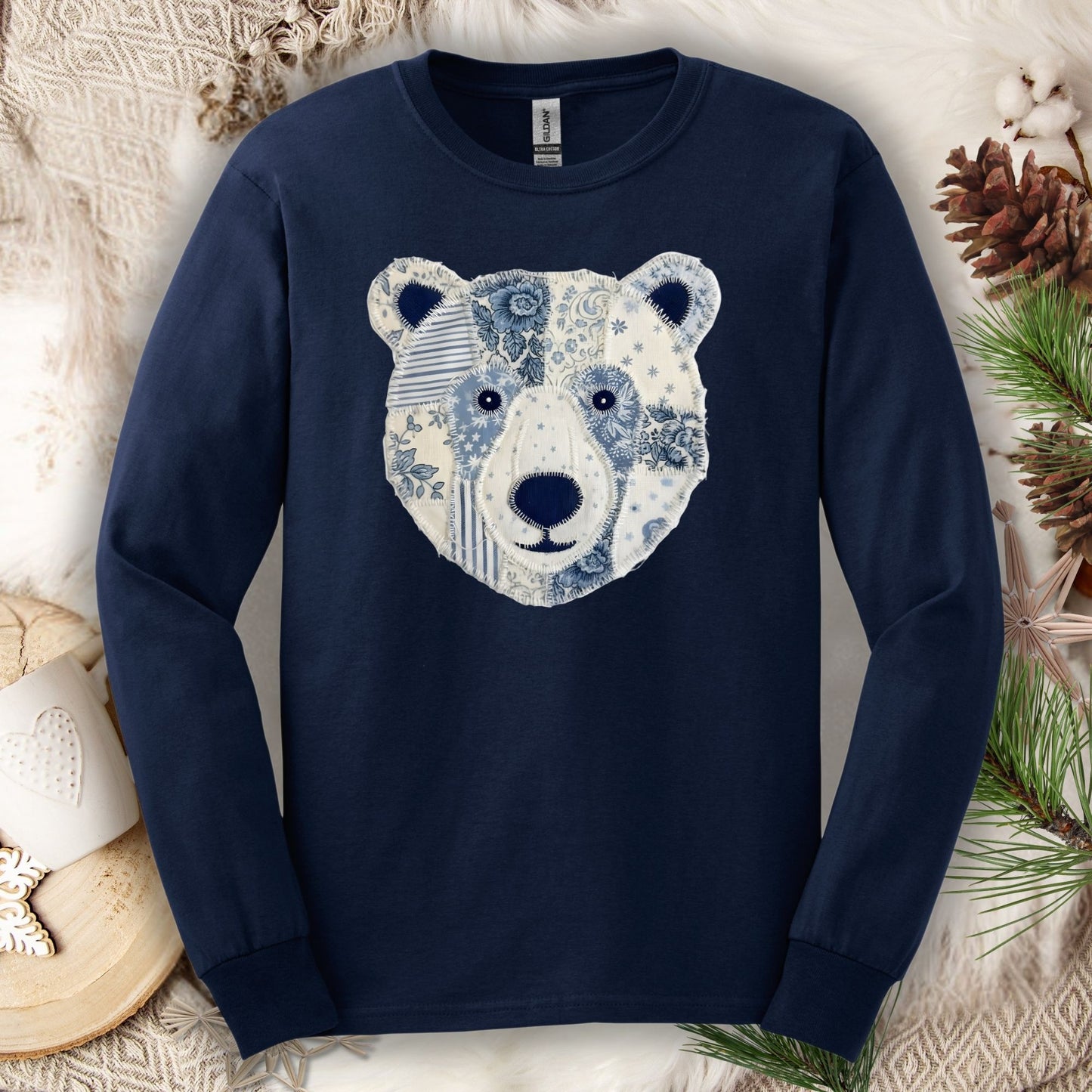 Navy long-sleeve tee with a faux patchwork winter bear face design, size S.