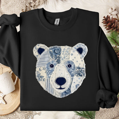 Black sweatshirt with a faux patchwork blue and white country winter bear design.
