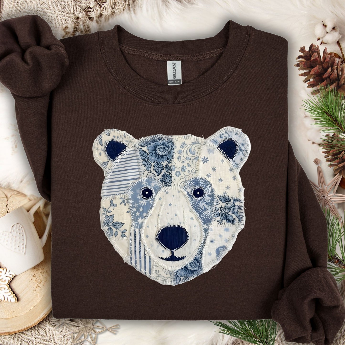 Dark chocolate faux patchwork country winter bear sweatshirt with blue and white patterns.