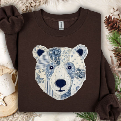 Dark chocolate faux patchwork country winter bear sweatshirt with blue and white patterns.