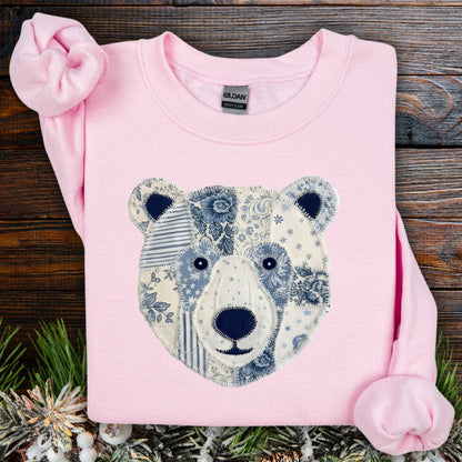 Light pink Gildan sweatshirt with a faux patchwork blue and white country winter bear design.
