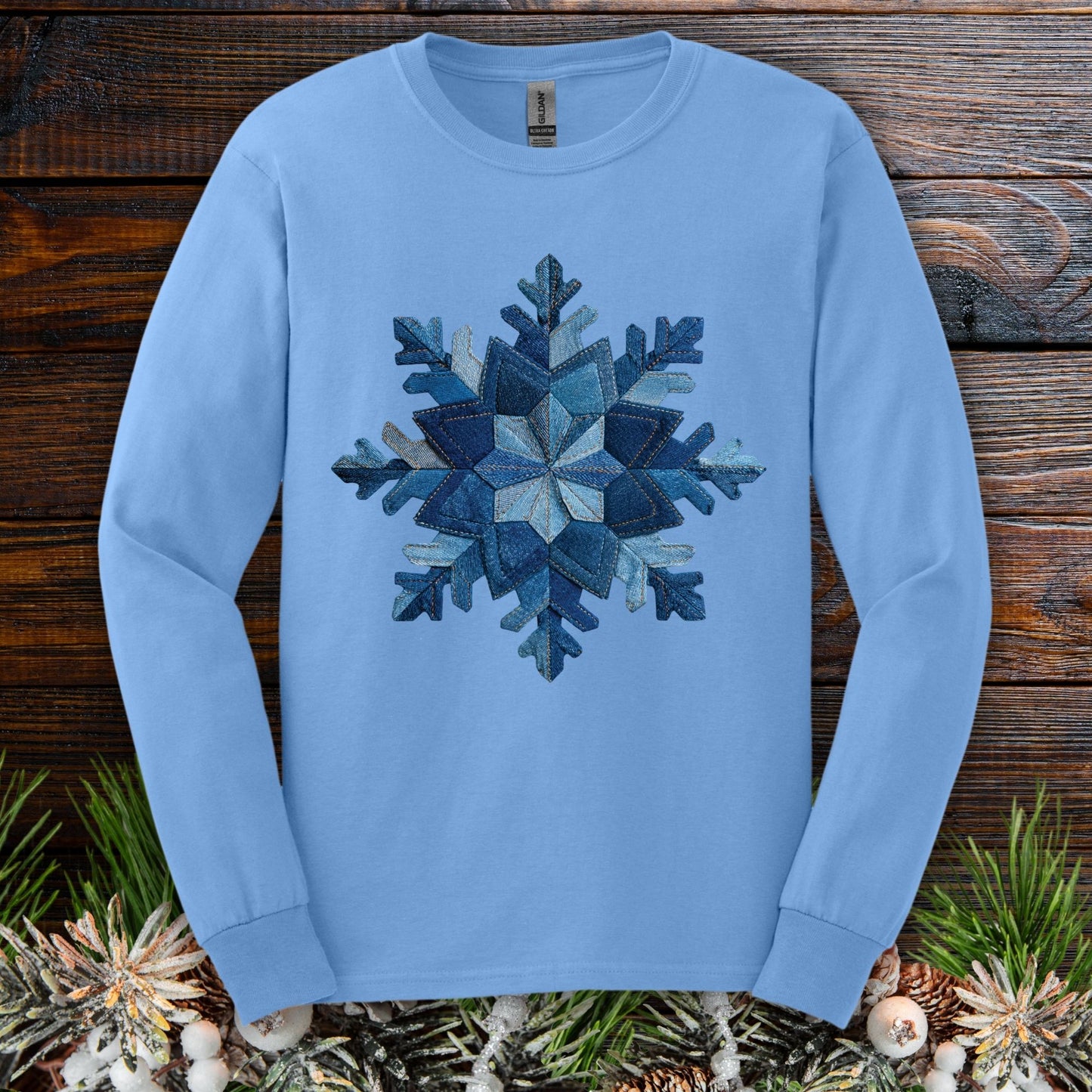 Carolina Blue long sleeve tee with a printed faux patchwork denim snowflake design.