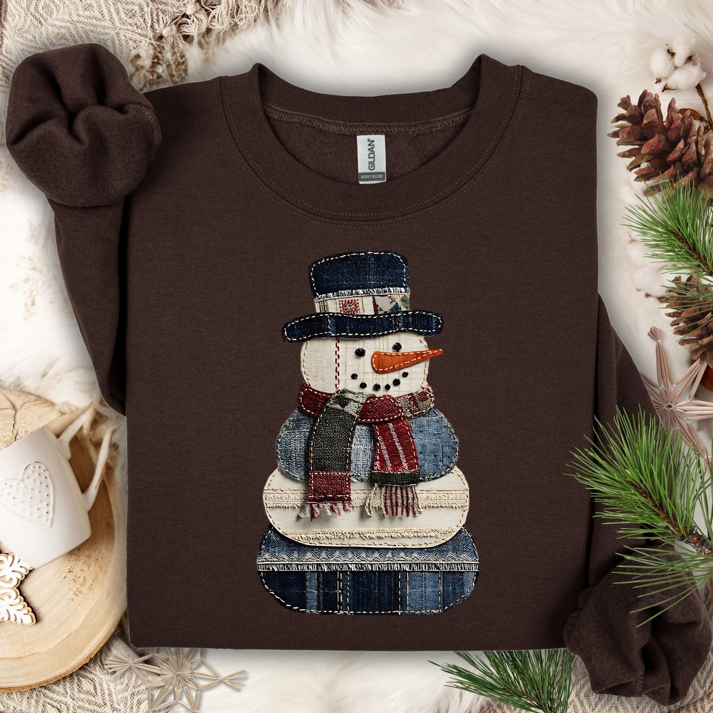 Dark Chocolate Gildan sweatshirt with a faux patchwork denim snowman design.