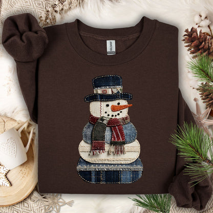 Dark Chocolate Gildan sweatshirt with a faux patchwork denim snowman design.