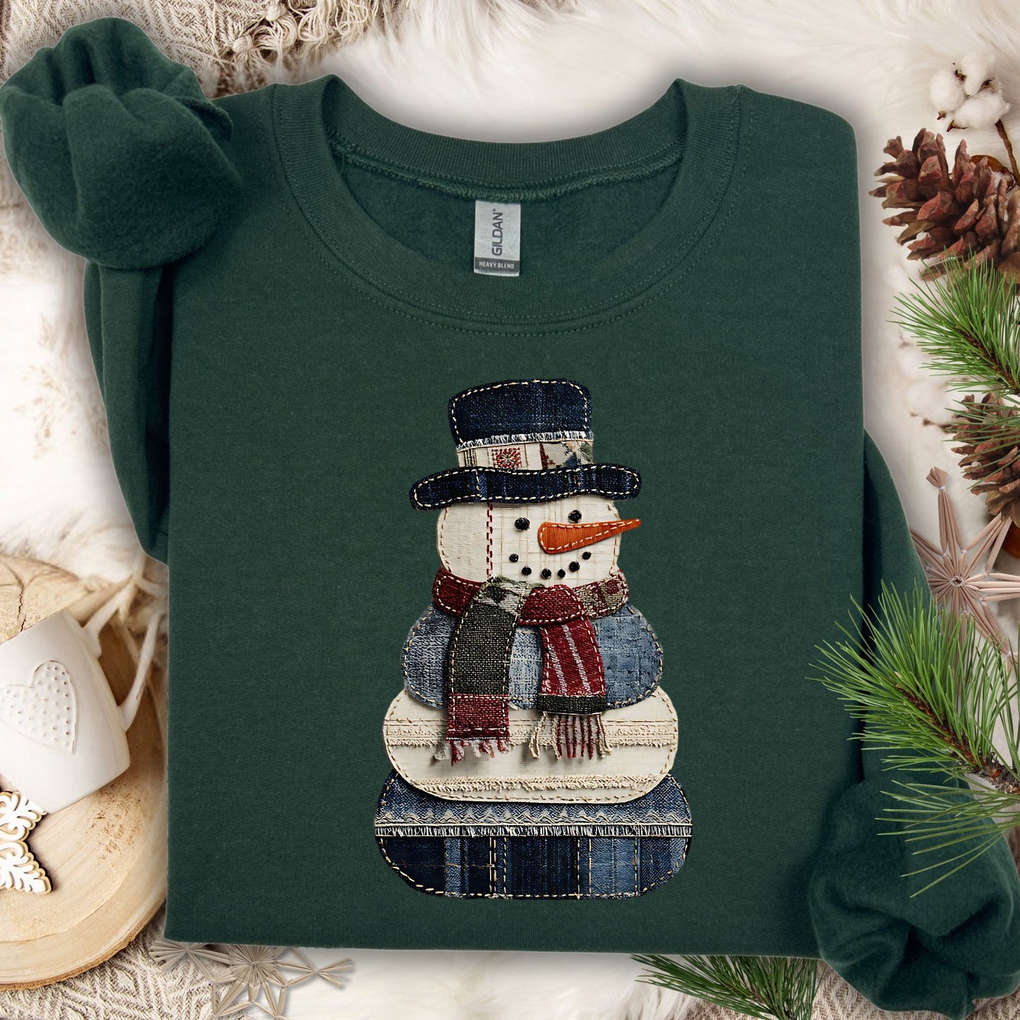 Forest Green Gildan sweatshirt with a printed faux patchwork denim snowman design.