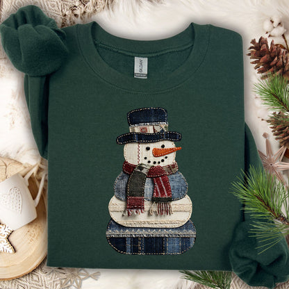 Forest Green Gildan sweatshirt with a printed faux patchwork denim snowman design.