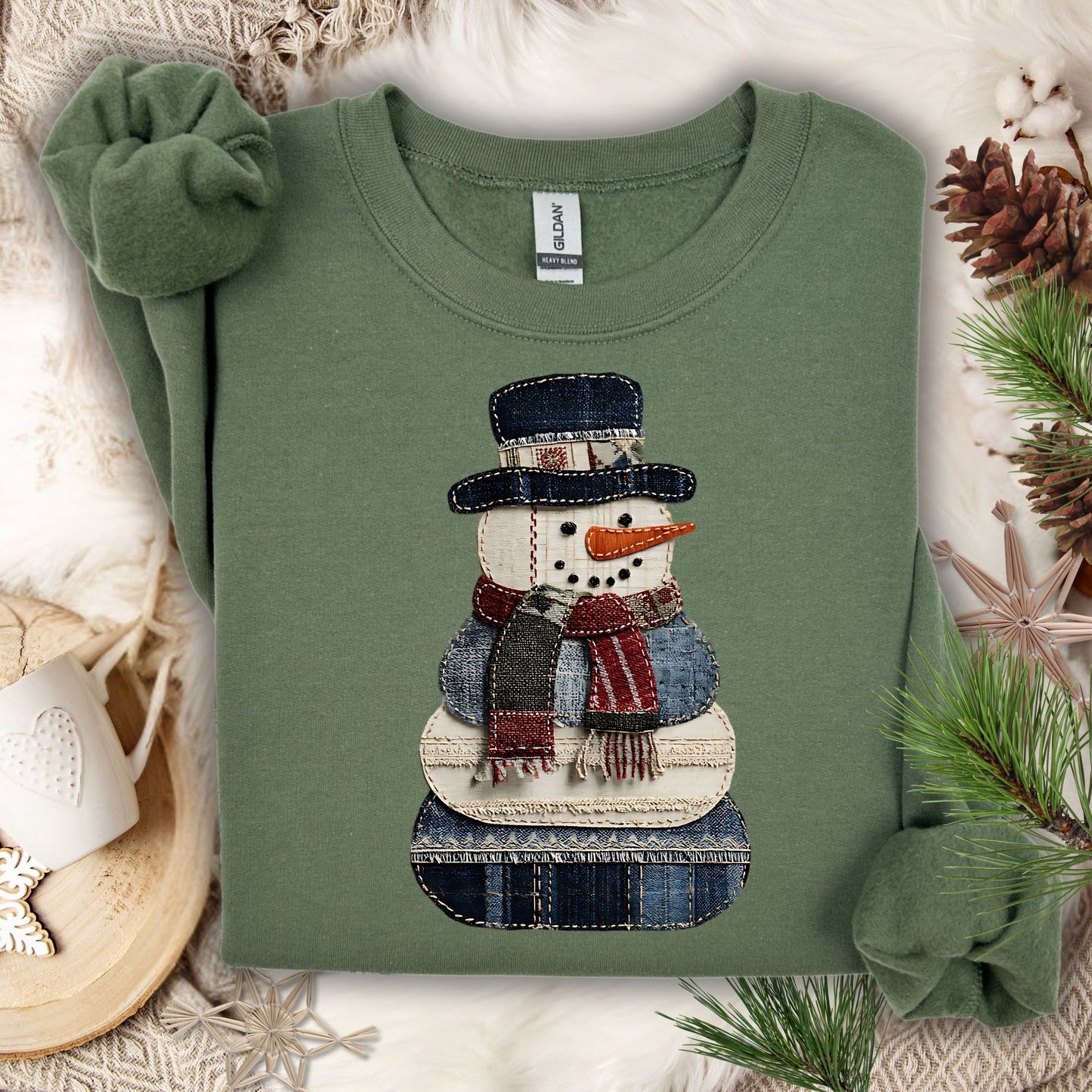 Military Green Gildan sweatshirt with a faux patchwork denim snowman design.