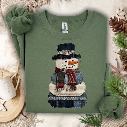 Military Green Gildan sweatshirt with a faux patchwork denim snowman design.
