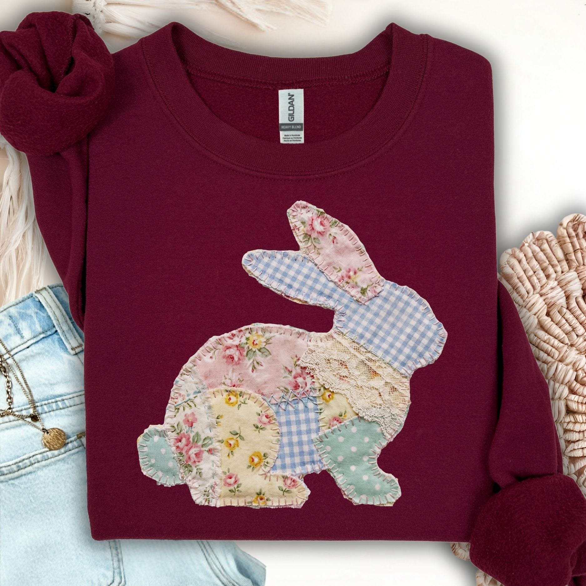 Maroon crewneck sweatshirt with a faux patchwork floral and gingham bunny applique.