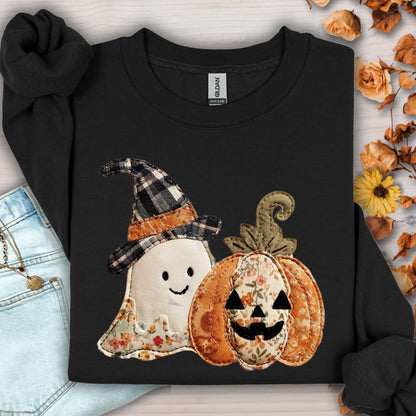 Black Gildan sweatshirt with faux patchwork ghost in witch hat and floral jack-o-lantern.