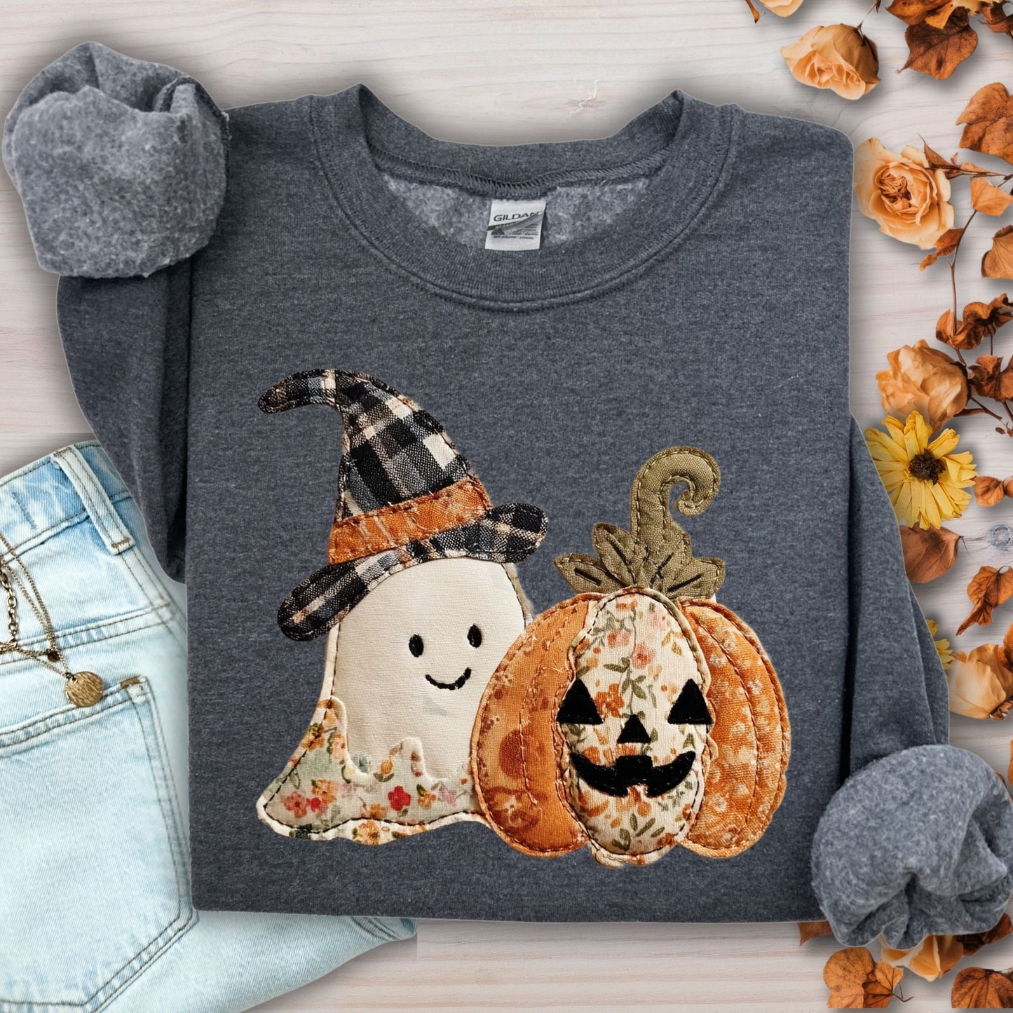Dark Heather Gildan sweatshirt with faux patchwork ghost in witch hat and jack-o-lantern.