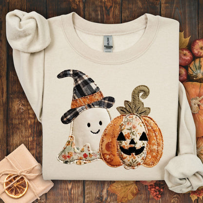 Sand crewneck sweatshirt with faux patchwork ghost in witch hat and jack-o-lantern.