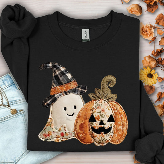 Black Gildan sweatshirt with faux patchwork ghost in witch hat and floral jack-o-lantern.