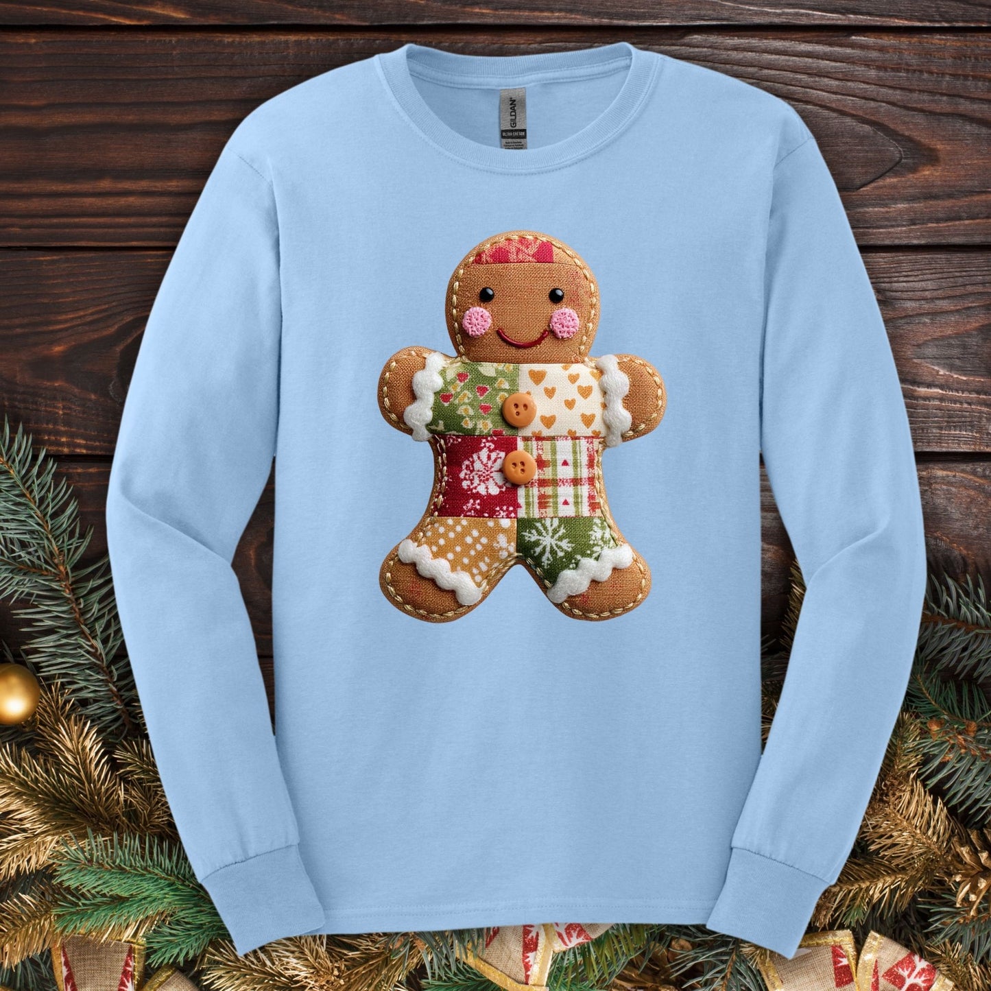 Light blue Gildan long sleeve tee with a vintage patchwork gingerbread man design.