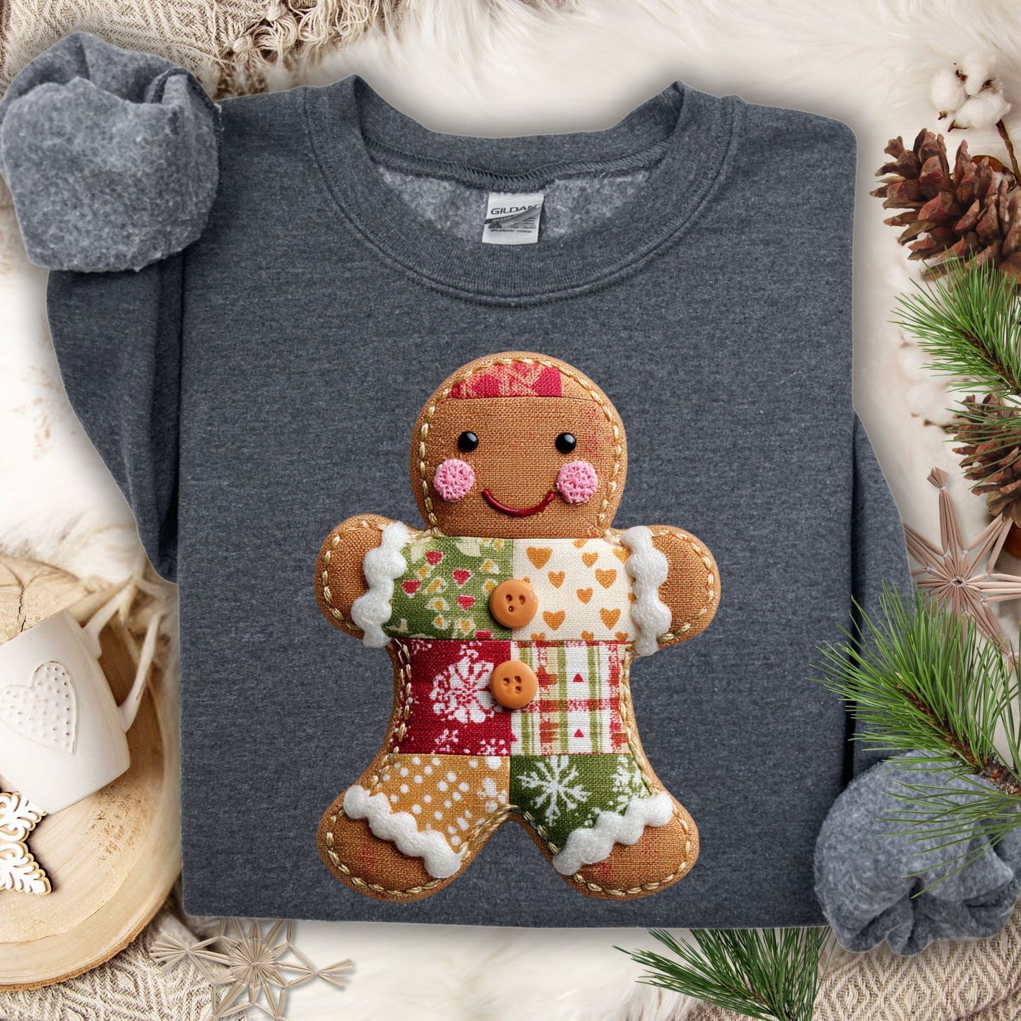 Dark Heather Gildan sweatshirt with a vintage-style faux patchwork gingerbread man graphic.